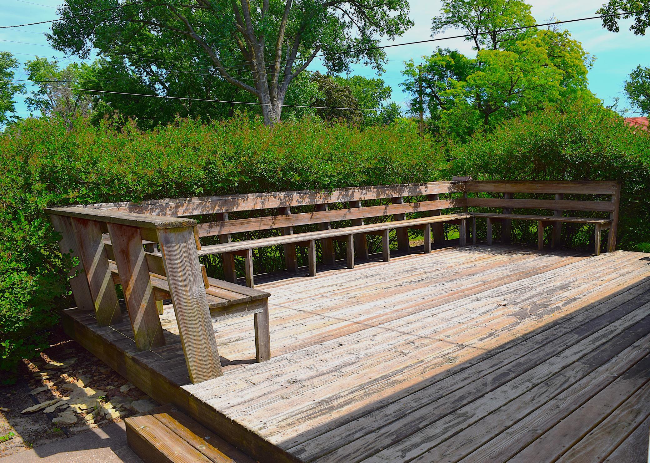 Walk outside to the spacious 20 x 16 foot deck with built-in bench seating!