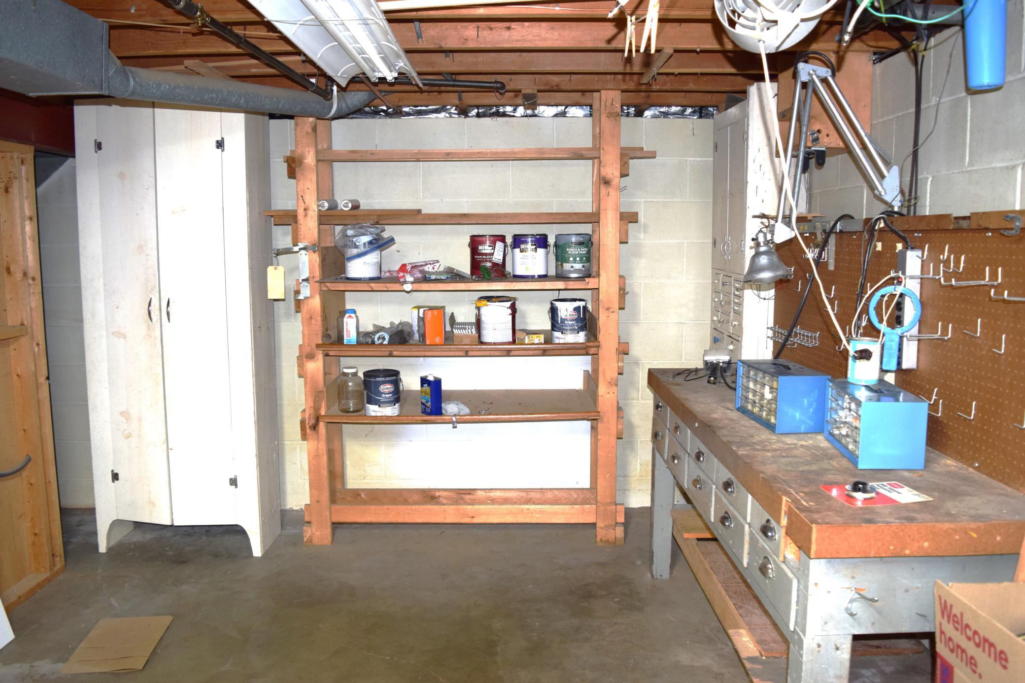 Plenty of storage and a great workbench is located in the lower level as well!