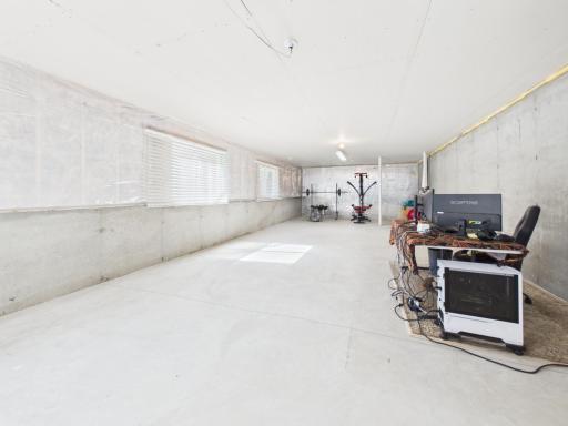 Unfinished basement with plenty of natural lighting