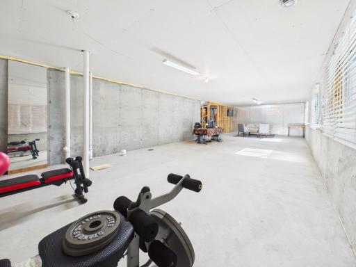 Unfinished basement with rough-in bathroom plumbing