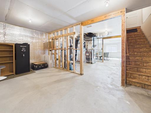 Unfinished basement with additional storage area