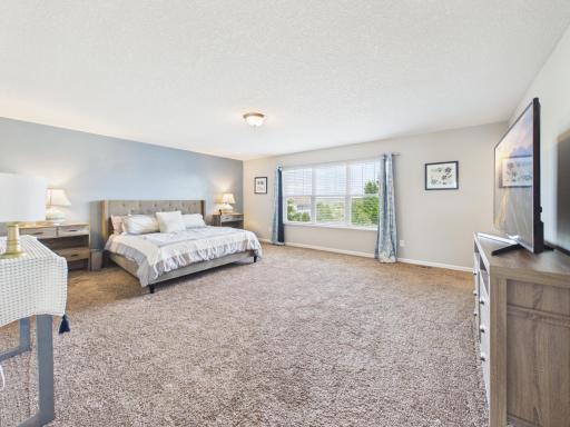 Primary bedroom/Suite with large window allowing natural light