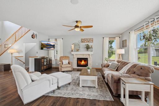 Elegant Main Level Living Room With Charming Fireplace & Lots Of Natural Light!