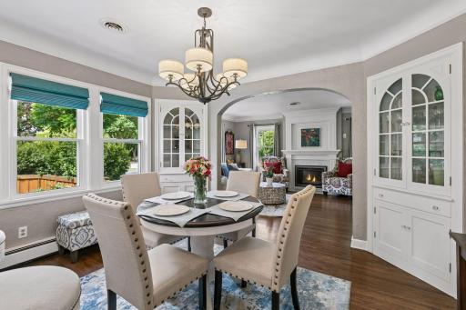 Built-in corner hutches, white painted trimwork in the dining room space with updated lighting, newer windows.