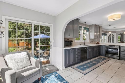 Sliding patio doors lead from the kitchen space to the stamped concrete patio - ideal layout for having guests over or dining al fresco.