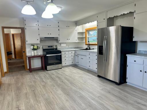 Lots of Space to Add a Center Island. Newer Stainless Steel Refrigerator is Included With the Sale.