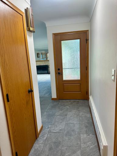 Front Entrance Foyer With Coat Closet and Newer Front Door.