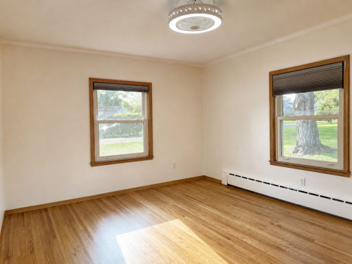 Bedroom 2 - Newer Windows and Gorgeous Oak Hardwood Flooring.