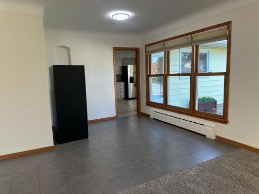 Tiled Dining Area or "Flex" Space. Use As Office or Excercise Area or?