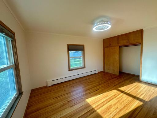 Bedroom 2 - Large Double Closet With Upper Cabinets For Extra Storage.