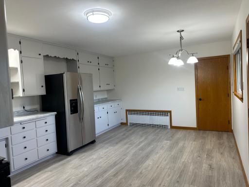 Lots of Room for a Large Family Table to Gather Around. Door Leads to the Lower Level.