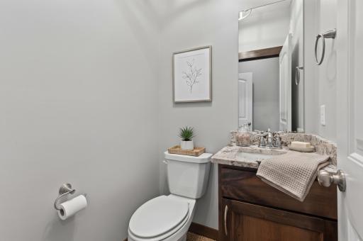 Main Floor 1/2 Bath - Photo has been virtually staged for visualization purposes.
