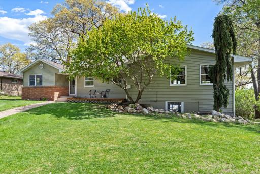 Your dreamy lake home awaits! Incredible Coon Lake Rambler on beautiful .77-acre lot offering approximately 100ft of waterfront.