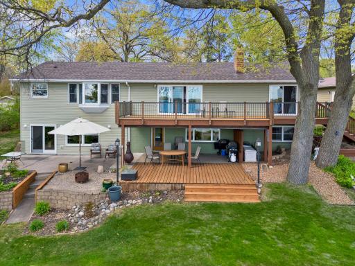 Outdoor spaces are perfection! Decks, patios with panoramic lake views!