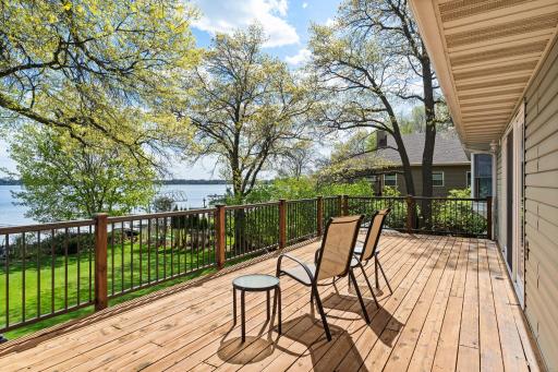 Beautifully maintained deck offers a perfect spot to soak up lake live on Coon Lake!