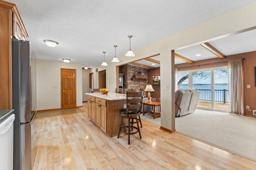 Open floor plan! Gorgeous hardwood flooring spans the kitchen and hallway. Neutral paint, carpeting throughout makes this well maintained and move in ready and just enjoy the lake!