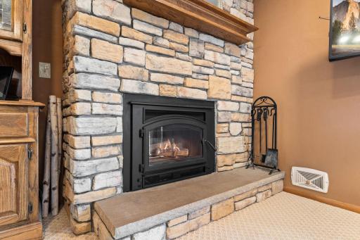 Beautiful stone gase fireplace is a highlight of this main level living!