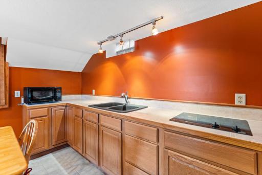 2nd kitchen or wet bar setup ideal for entertaining guests or a perfect opportunity for multi-generational living all while enjoying lake life on Coon Lake.