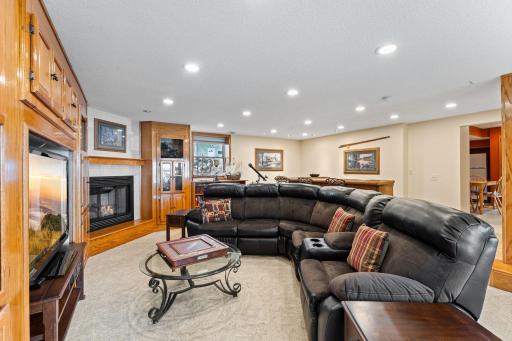Beautiful natural wood built-ins and coze corner fireplace.