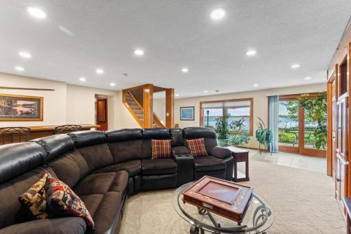 Lower-level walkout retreat offers an incredible space to relax or entertaining guests.