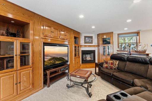 Beautiful natural wood built-ins and coze corner fireplace.