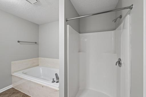 Enjoy both a separate shower and relaxing soaking tub in the spacious bath.