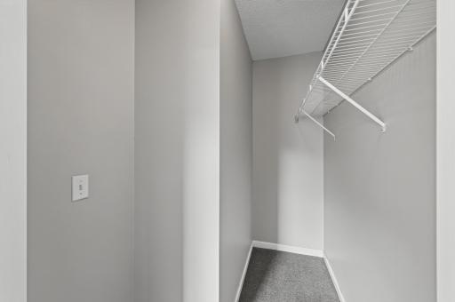Walk-in closet provides generous storage and organization space.