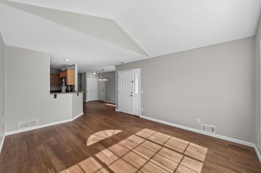 Open-concept living area seamlessly connects the living room, dining space, and kitchen for easy everyday living and entertaining.