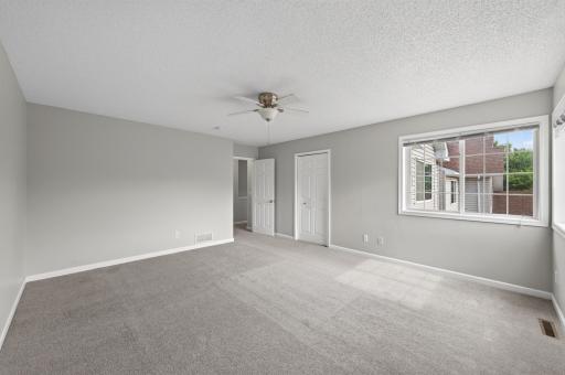 Oversized primary retreat with abundant natural light and a spacious layout.