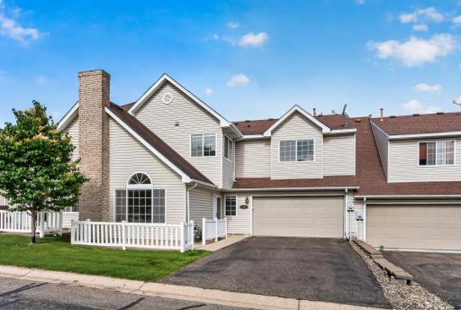Beautiful townhome with an attached two-car garage and charming curb appeal.