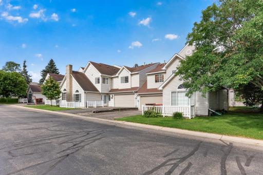 Quiet community setting with mature trees, ample guest parking, and well-maintained grounds.