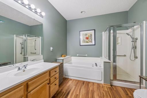 Spacious Primary bath with separate shower and jetted tub. Linen closet is also in the room.