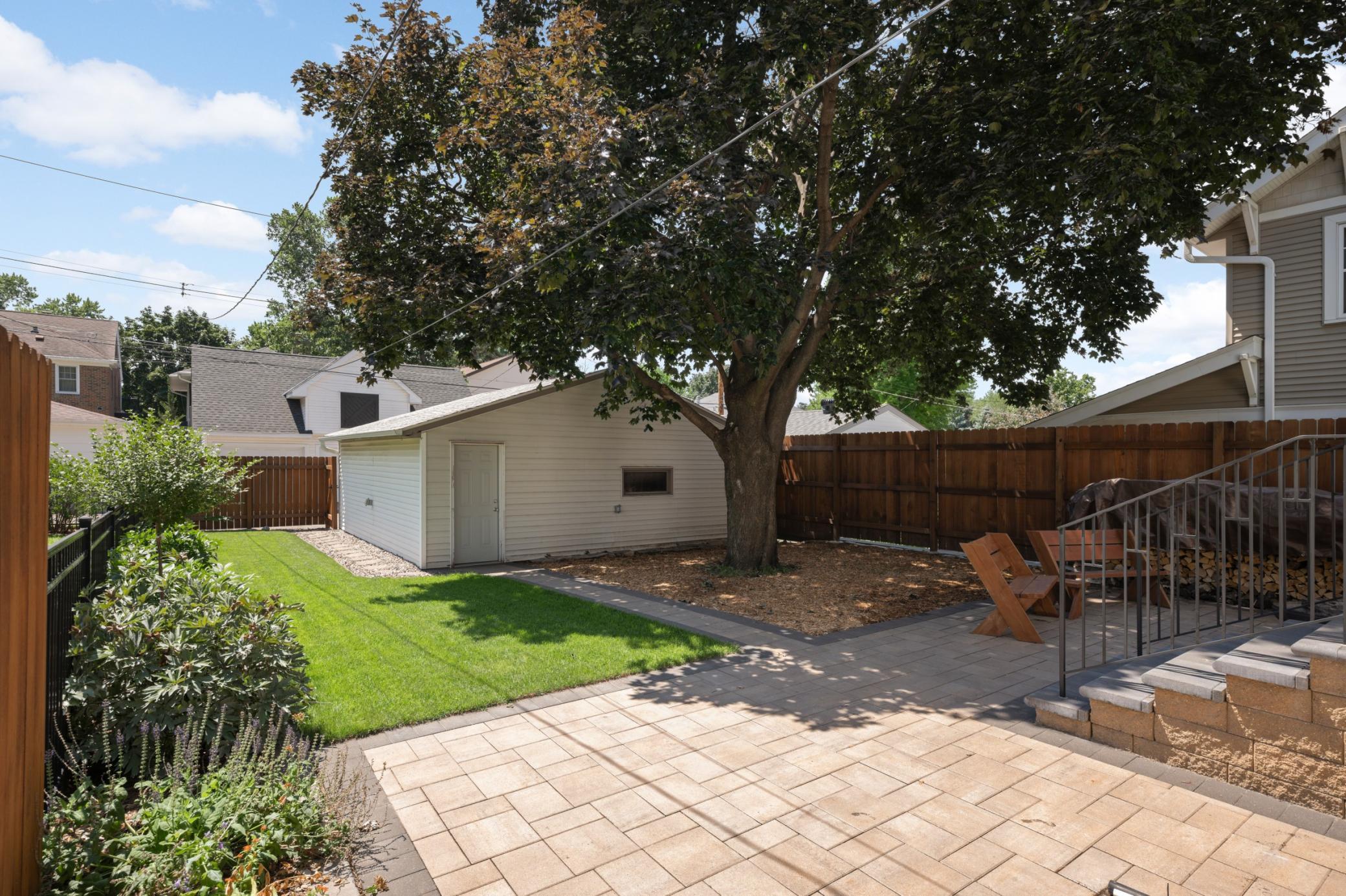 Green space, gardens and oversized 2 car garage!