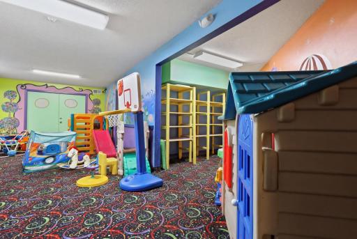 Kids Play Room; this spacious and colorful children's playroom offers a welcoming retreat for fun and creativity, providing the perfect setting for playdates, learning, and year-round family enjoyment