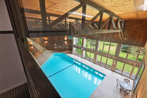 Step into pure relaxation in this heated indoor pool, where warm waters and natural light create a peaceful retreat for year-round comfort and tranquility