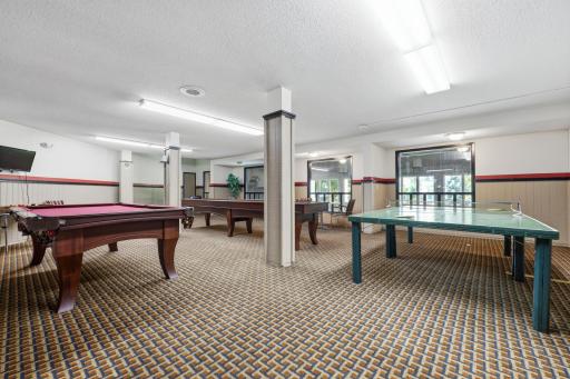 Gather, compete, and create lasting memories in this spacious game room, featuring billiards and table tennis for endless fun with family and friends