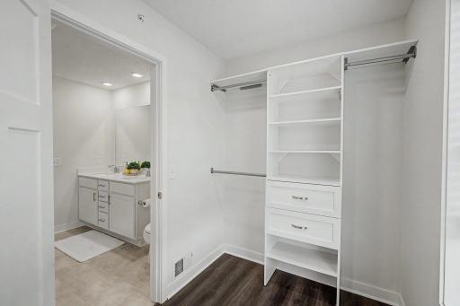 Primary walk-in closet w/built in shelving