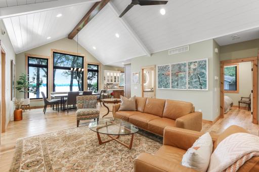 From the moment you enter, you're greeted by breathtaking lake views and an open-concept floor plan designed to maximize natural light and create an inviting flow throughout the home.