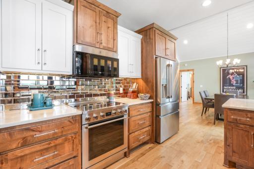 The kitchen is equipped with high-quality appliances, offering exceptional performance, modern convenience, and sophisticated style.