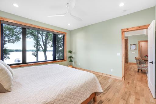 Breathtaking views from the primary bedroom create a serene and unforgettable retreat, where you can wake up and unwind surrounded by natural beauty.