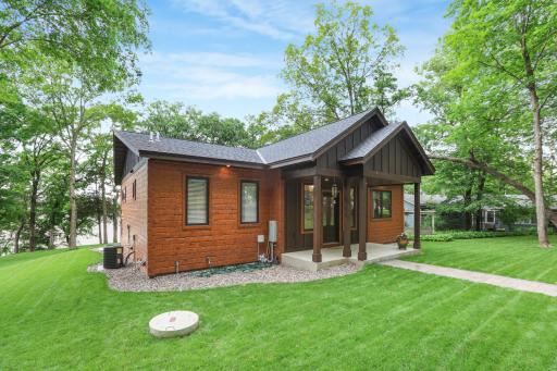 The covered, east-facing front porch offers a welcoming outdoor space ideal for enjoying peaceful morning sunrises and relaxing in comfort.