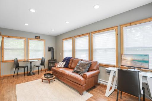 The guest cabin features electric heat and a cozy gas fireplace, providing comfort and warmth for year-round use.