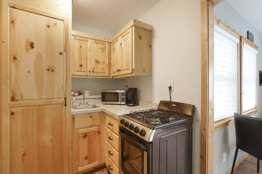 The guest cabin features a fully equipped kitchen, offering convenience and comfort for extended stays and independent living.