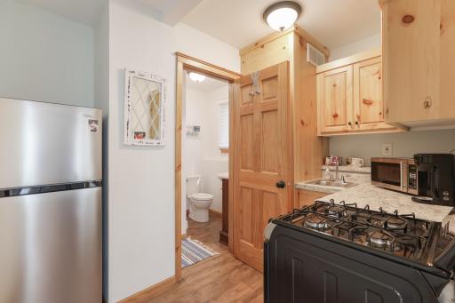 The guest cabin includes a kitchen and bathroom, offering a fully functional and private space for family and visitors.