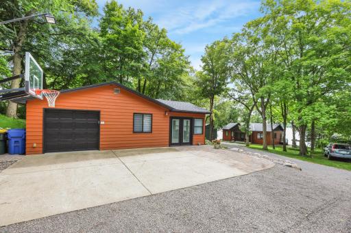The property includes a guest cabin and a one-stall garage, offering added convenience, storage, and comfortable accommodations for family and visitors.