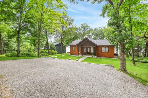 A great granite driveway offers a durable and attractive approach to the home, with ample parking space for guests, vehicles, and recreational toys.