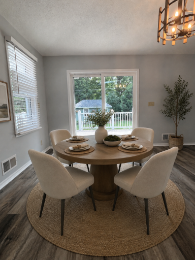 The main level boasts a living room and a family room. The dining space looks directly into the two tiered deck providing flexible indoor and outdoor dining options. Virtually staged.