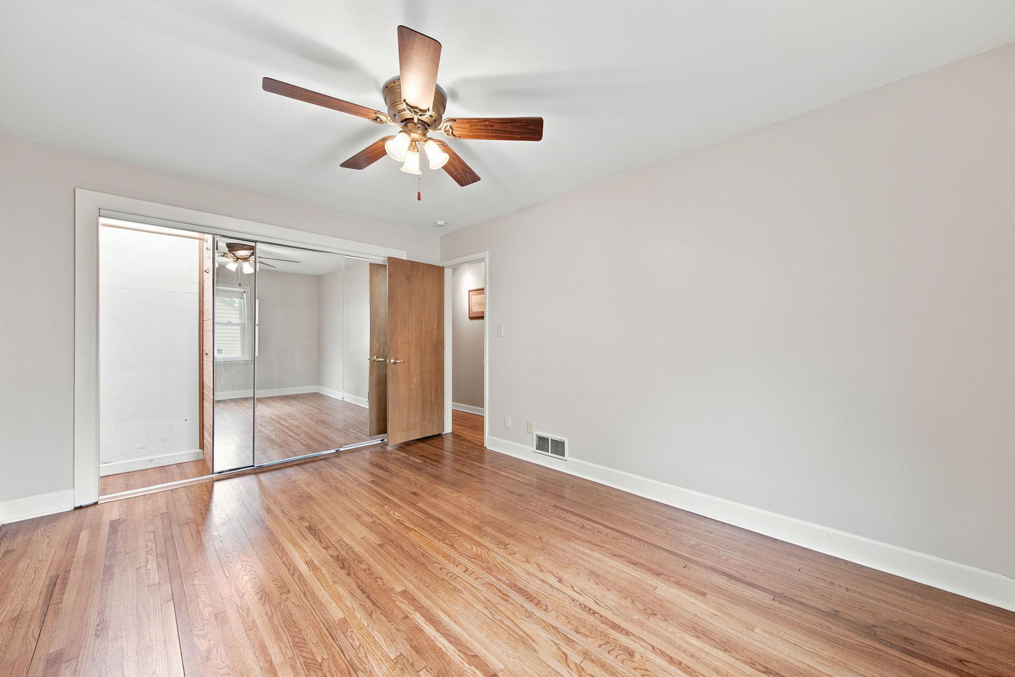 Different angle of the primary BR with view of the mirrored closet