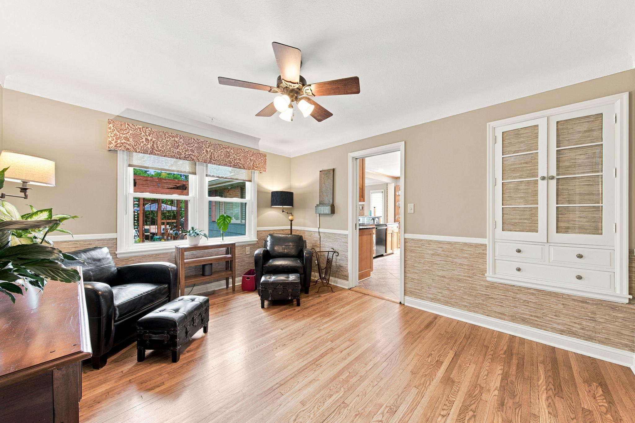 The former formal dining room has been converted into a cozy sitting room