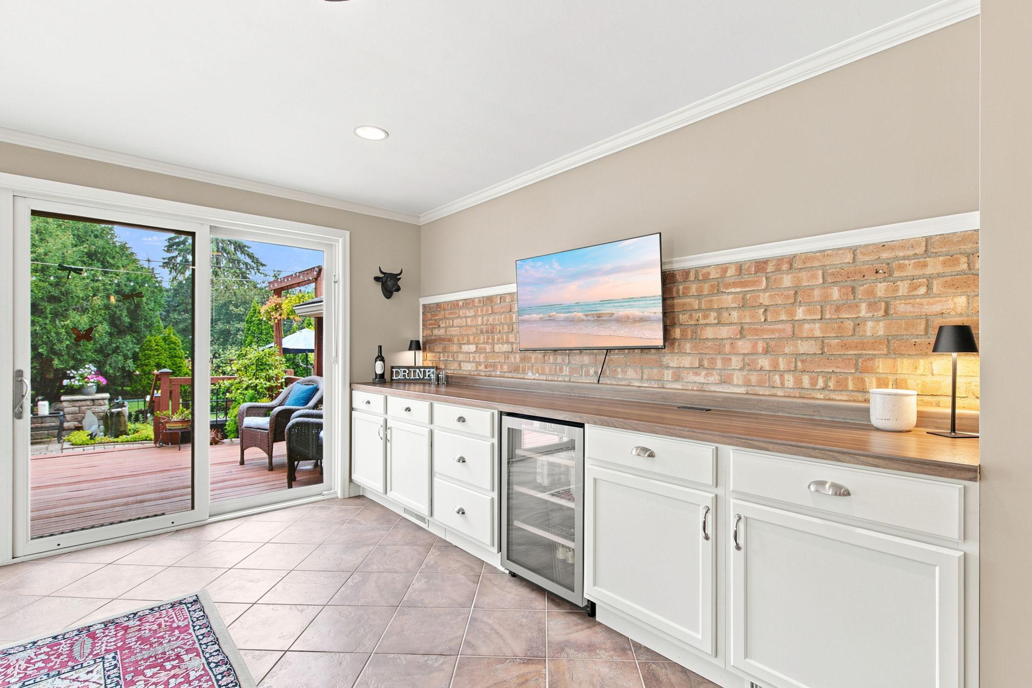Custom built-in buffet - please exclude the beverage refrigerator (the one in the lower level is included)